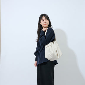 TT white carried off shoulder by lady