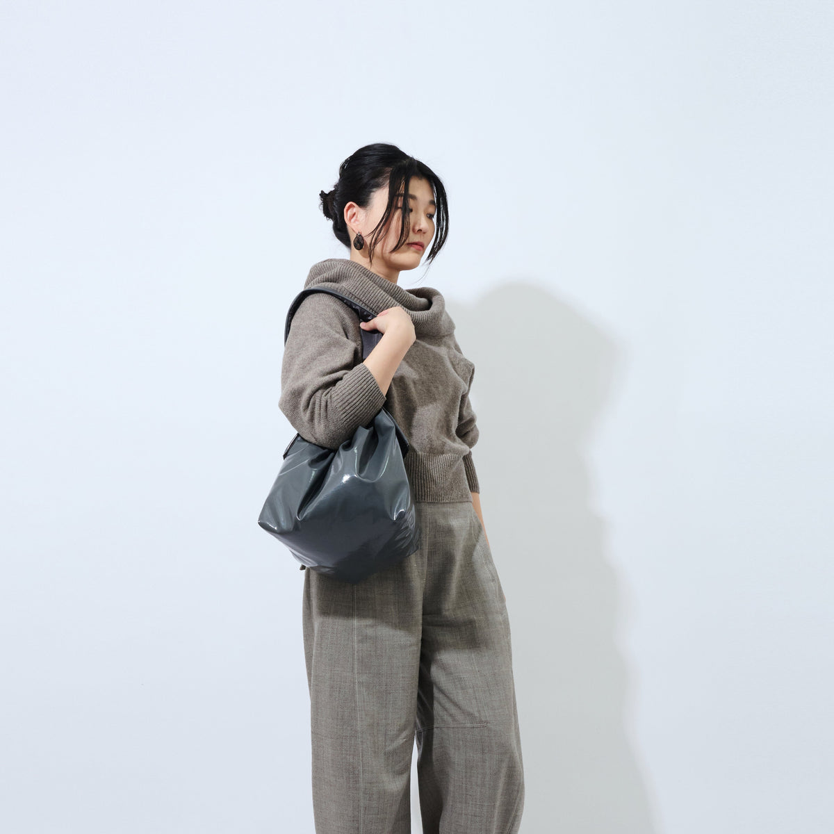 TT charcoal lifestyle photo carried by lady 