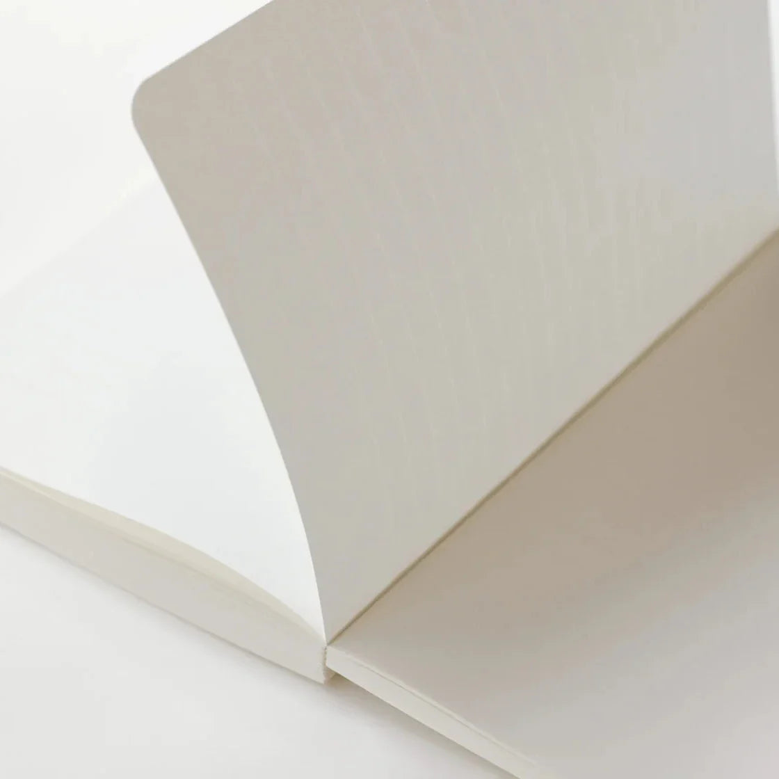 Close-up of a white notebook on a white background
