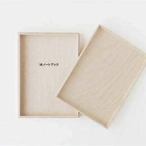 Beige notebook and cover on a white background