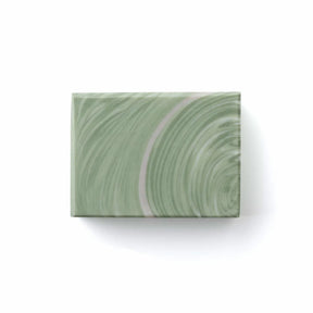 Rectangular green marble-patterned soap on a white background