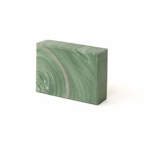 Green marbled soap bar on a white background